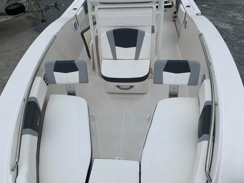 Slide: The Image of 2026 Robalo R200 Center Console boat interior with white and gray seating. - 13