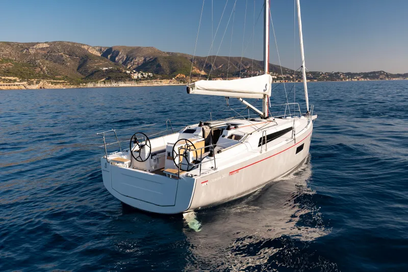 Slide: The Image of 2026 Beneteau Oceanis 34.1 sailboat on open sea. - 9