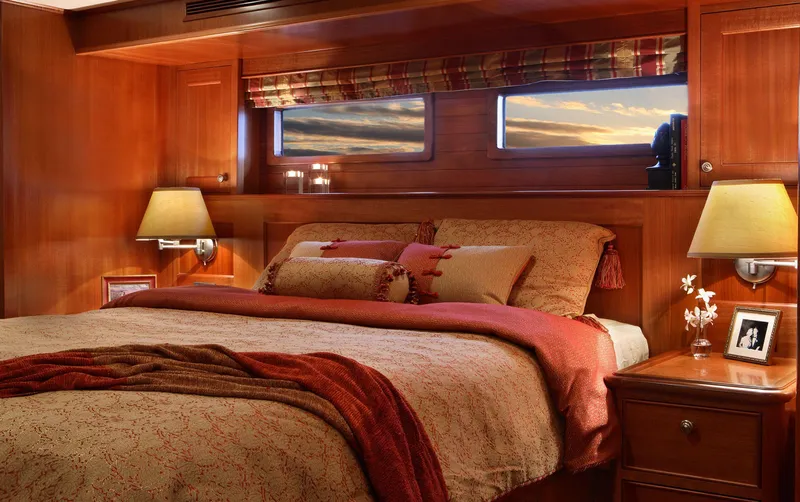 Slide: The Image of Luxurious bedroom interior of 2025 Northern Marine 64 yacht with elegant wooden finish. - 4
