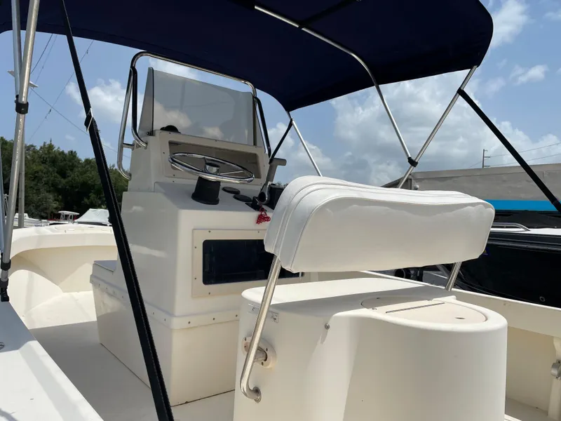 Slide: The Image of 2004 Parker 1801 Center Console boat with canopy and steering console. - 10
