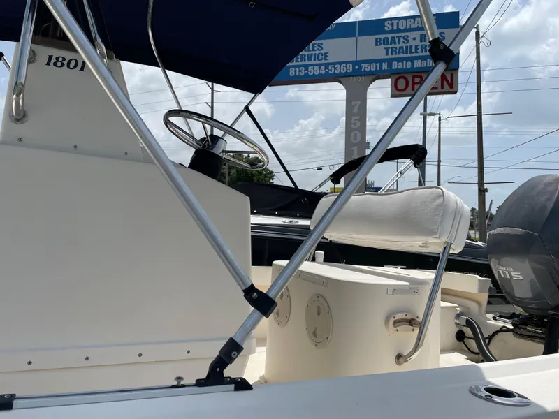 Slide: The Image of 2004 Parker 1801 Center Console boat with steering wheel and seating. - 11