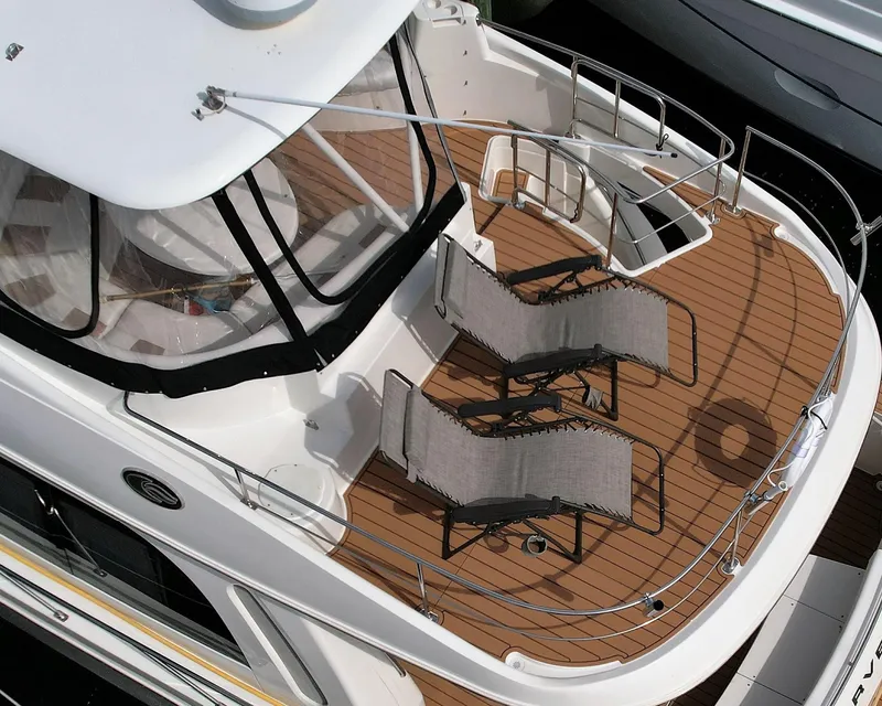 Slide: The Image of 2006 Carver 56 Voyager yacht deck with lounge chairs. - 18