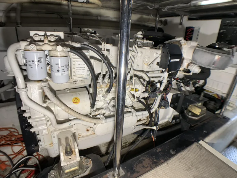 Slide: The Image of Engine room of a 2006 Carver 56 Voyager yacht showing detailed machinery. - 42