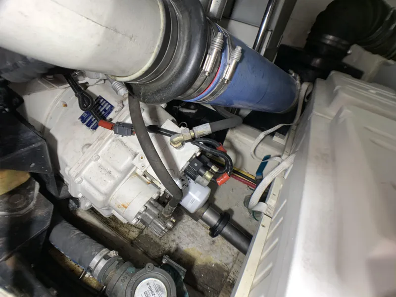 Slide: The Image of Engine compartment of a 2006 Carver 56 Voyager yacht showing mechanical components. - 49