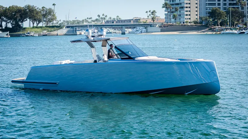 Slide: The Image of 2022 Pardo Yachts 43 cruising on calm waters near a marina. - 2