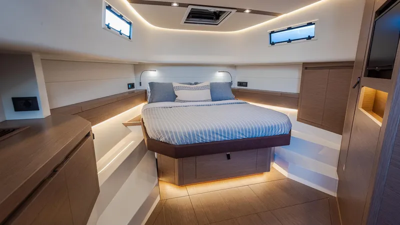 Slide: The Image of Luxurious cabin interior of 2022 Pardo Yachts 43 with modern lighting and cozy bed. - 25