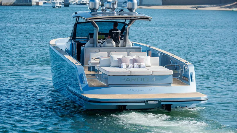 Slide: The Image of 2022 Pardo Yachts 43 cruising on water, showcasing luxury design and spacious deck. - 5
