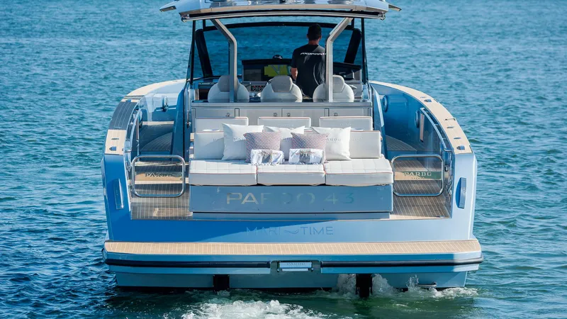 Slide: The Image of 2022 Pardo Yachts 43 cruising on water, rear view with luxurious seating. - 6