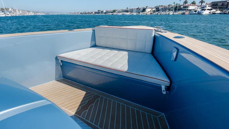 Slide: The Image of Luxurious seating on 2022 Pardo Yachts 43, overlooking serene marina waters. - 7