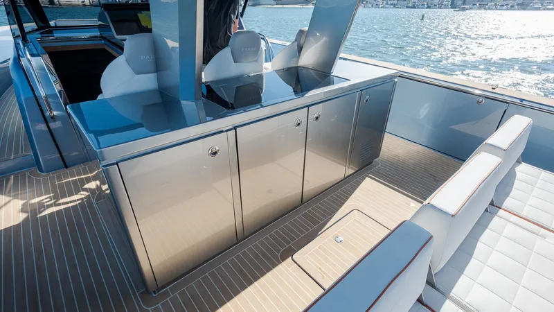 Slide: The Image of 2022 Pardo Yachts 43 interior with sleek cabinetry and seating, overlooking the water. - 17