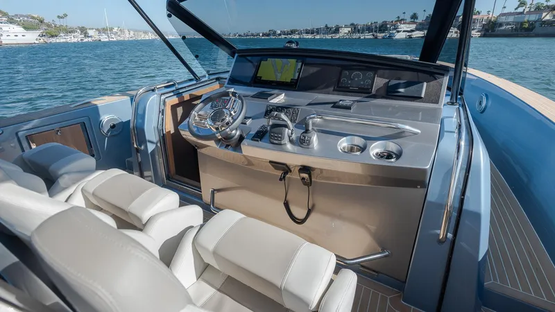 Slide: The Image of Interior view of 2022 Pardo Yachts 43 helm with modern controls and luxurious seating. - 18