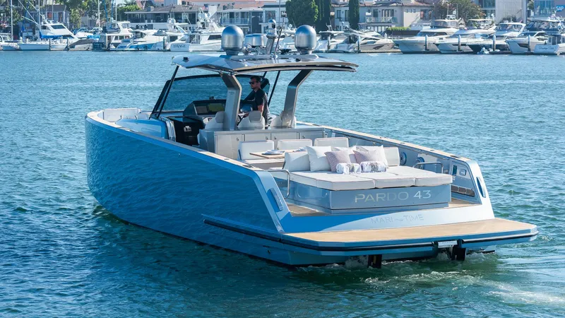 Slide: The Image of 2022 Pardo Yachts 43 cruising in a marina, showcasing sleek design and luxury features. - 4
