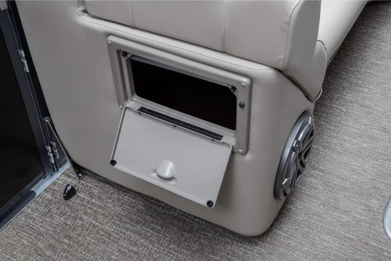Slide: The Image of Storage compartment on 2023 Premier 250 SunSation RE boat with beige upholstery. - 16