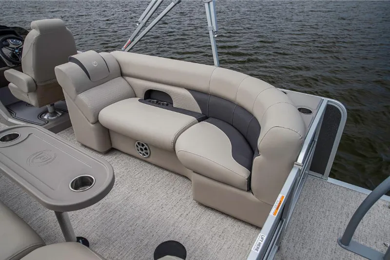 Slide: The Image of 2023 Premier 250 SunSation RE pontoon boat interior with plush seating and cup holders. - 9