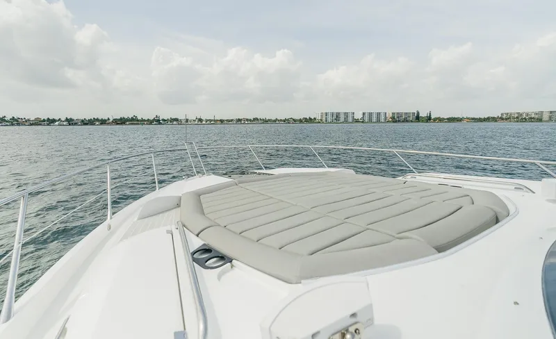 Slide: The Image of 2018 Sunseeker Predator 68 yacht bow with sunpad on open water. - 10