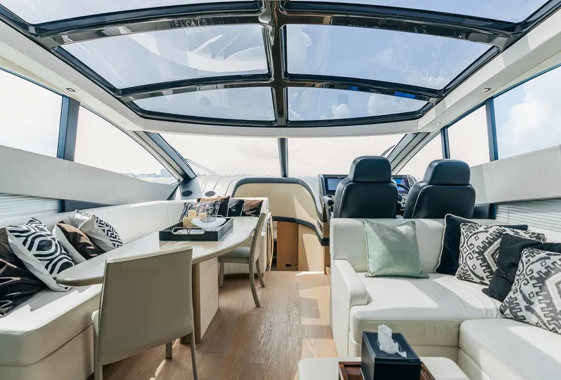 Slide: The Image of Luxurious interior of 2018 Sunseeker Predator 68 yacht with panoramic windows and modern furnishings. - 18