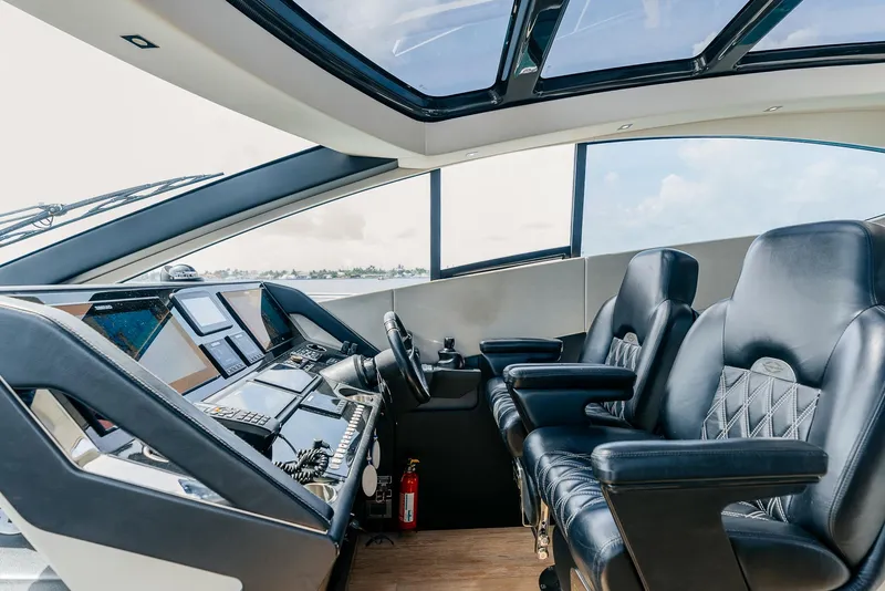 Slide: The Image of Interior helm of 2018 Sunseeker Predator 68 yacht with leather seats and advanced navigation. - 23