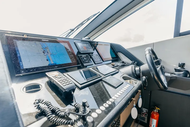 Slide: The Image of Cockpit of 2018 Sunseeker Predator 68 yacht with advanced navigation systems. - 24