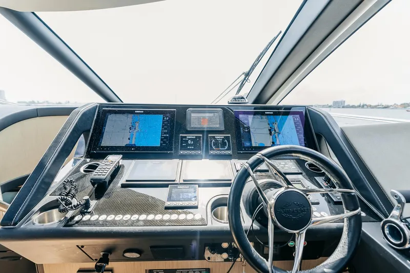 Slide: The Image of Cockpit of 2018 Sunseeker Predator 68 yacht with advanced navigation systems. - 25