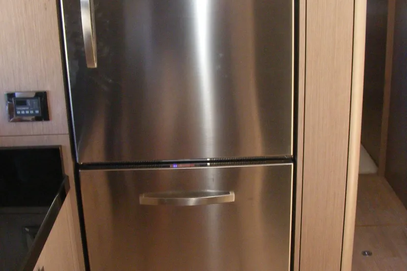 Slide: The Image of Stainless steel refrigerator in the 2018 Sunseeker Predator 68 yacht kitchen. - 29