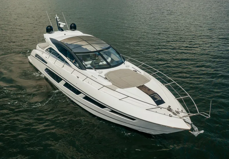 Slide: The Image of 2018 Sunseeker Predator 68 luxury yacht cruising on open water. - 3