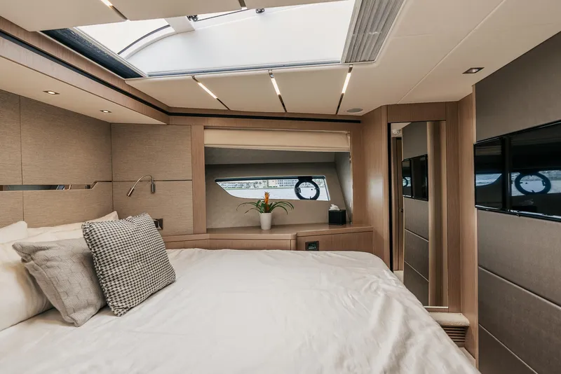 Slide: The Image of Luxurious bedroom interior of 2018 Sunseeker Predator 68 yacht with skylight and modern decor. - 31