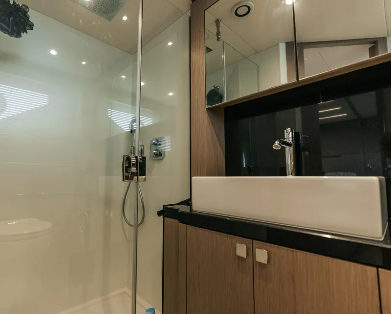 Slide: The Image of Modern bathroom in 2018 Sunseeker Predator 68 yacht with glass shower and sleek sink. - 43