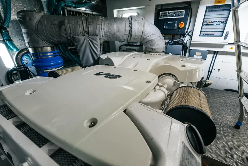 Slide: The Image of Engine room of a 2018 Sunseeker Predator 68 yacht, showcasing advanced machinery. - 48