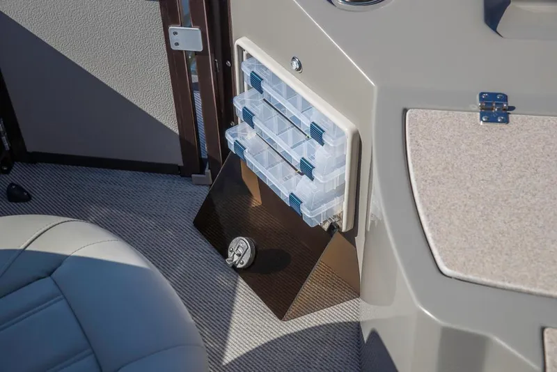 Slide: The Image of 2023 Premier 220 Castaway boat interior storage compartments and seating. - 17
