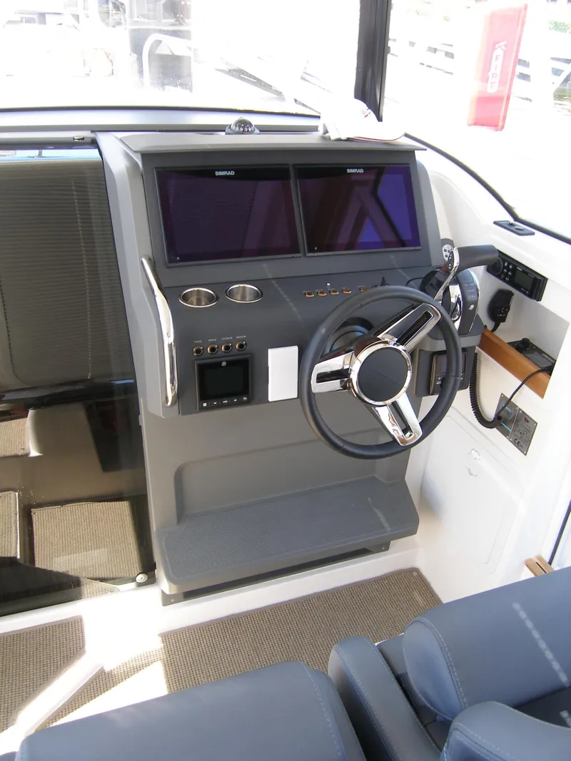 Slide: The Image of Modern helm station of Nimbus C9 2025 boat with dual screens and advanced controls. - 1