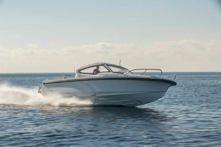 Slide: The Image of 2025 Nimbus W9 boat cruising on open water. - 24