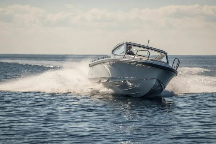 Slide: The Image of Nimbus W9 2025 model speedboat cruising on open water. - 25