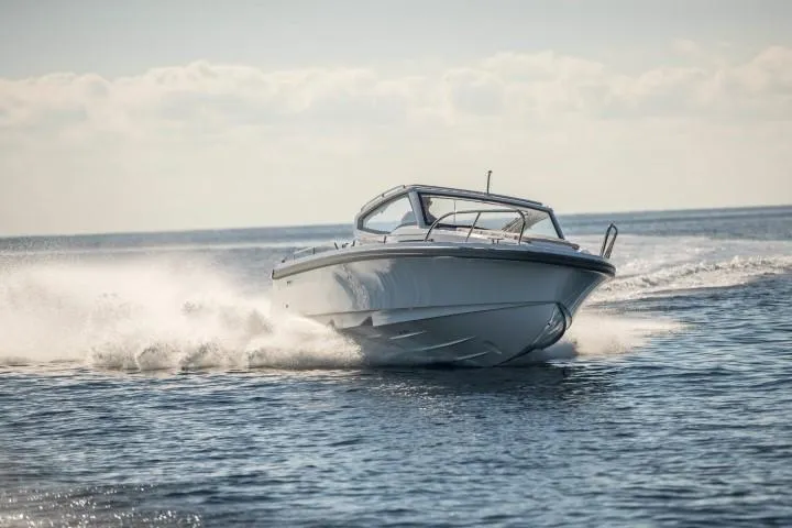 Slide: The Image of 2025 Nimbus W9 boat cruising on open water. - 26