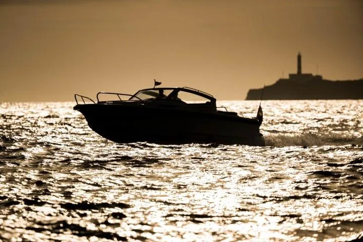 Slide: The Image of Silhouette of Nimbus W9 boat cruising at sunset, 2025 model. - 37