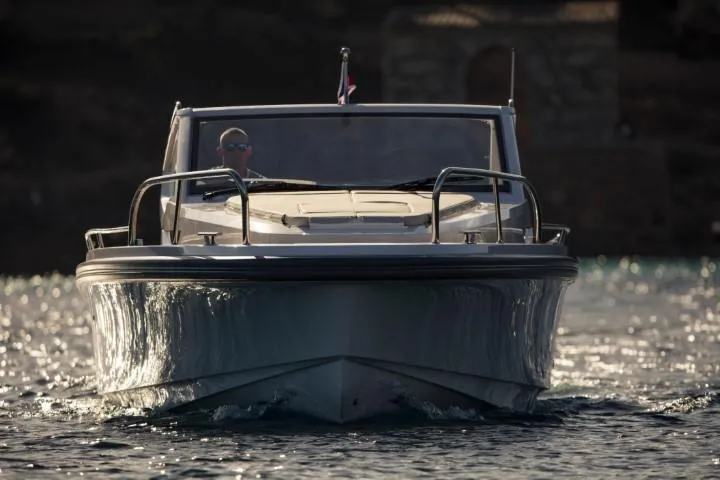 Slide: The Image of Front view of 2025 Nimbus W9 boat cruising on water. - 5