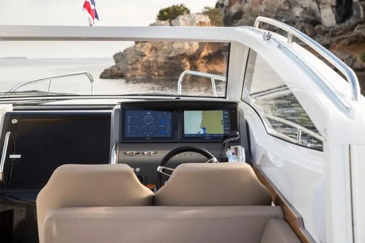 Slide: The Image of Interior view of 2025 Nimbus W9 boat cockpit with navigation screens. - 7