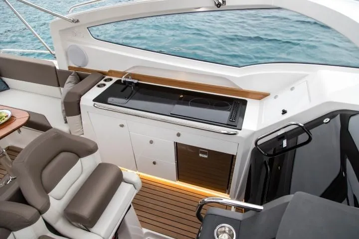 Slide: The Image of Modern kitchen area on the 2025 Nimbus W9 boat with ocean view. - 33