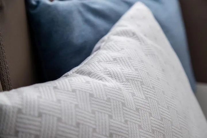 Slide: The Image of Close-up of textured white and blue cushions on a Nimbus W9, 2025 model. - 36