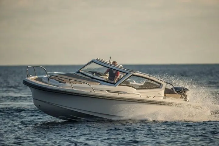 Slide: The Image of Nimbus W9 2025 model speedboat cruising on open water. - 47