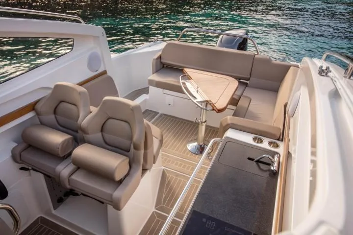 Slide: The Image of Luxurious interior of the 2025 Nimbus W9 boat with plush seating and modern amenities. - 48