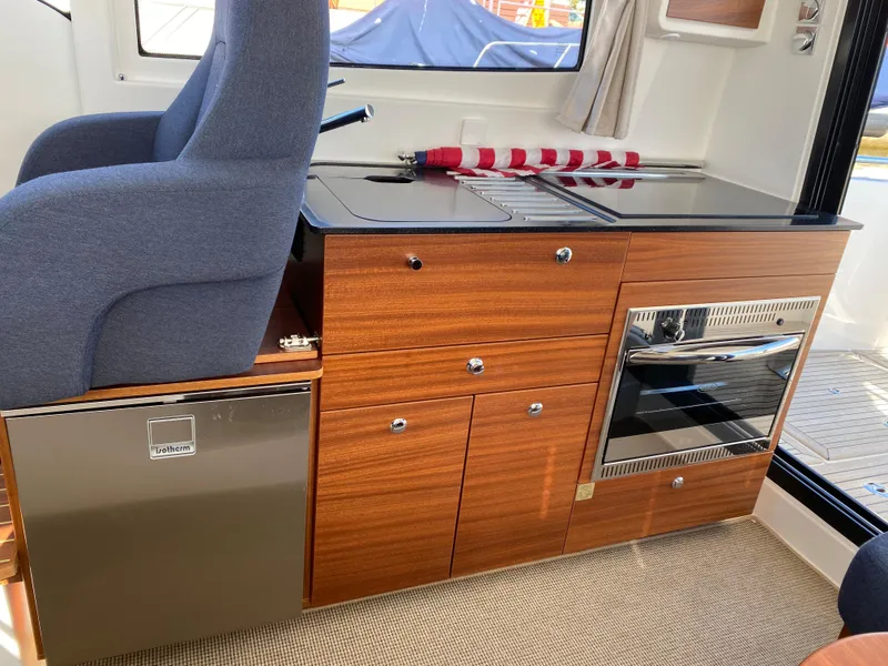 Slide: The Image of Interior of 2024 Nimbus 305 Coupe with modern kitchen amenities. - 7