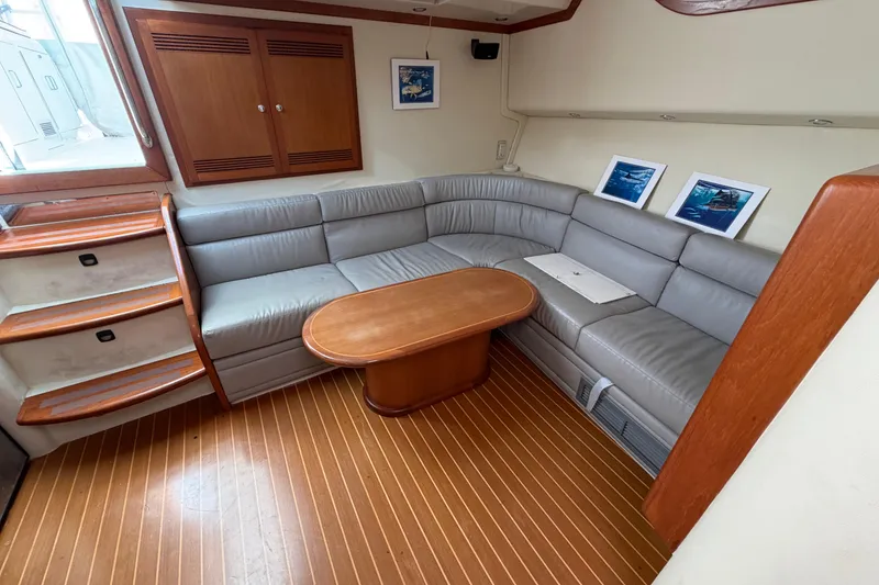 Slide: The Image of Luxurious interior of 2003 Cabo 45 Express yacht with leather seating and wooden accents. - 11