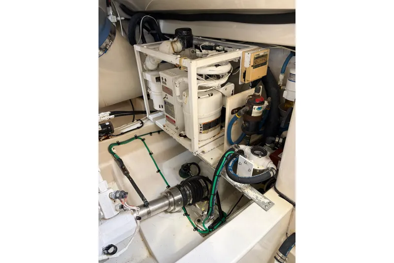 Slide: The Image of Engine room of 2003 Cabo 45 Express boat with mechanical components and piping. - 16