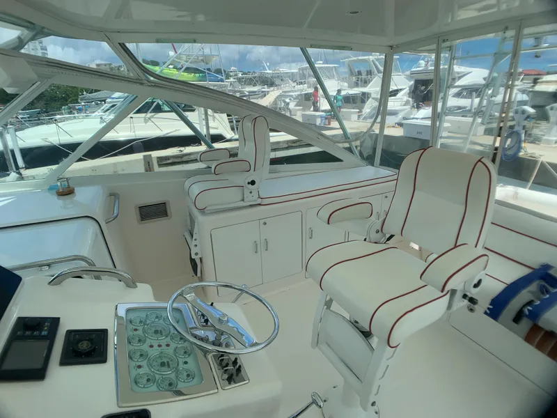 Slide: The Image of Interior of a 2003 Cabo 45 Express yacht with helm station. - 5