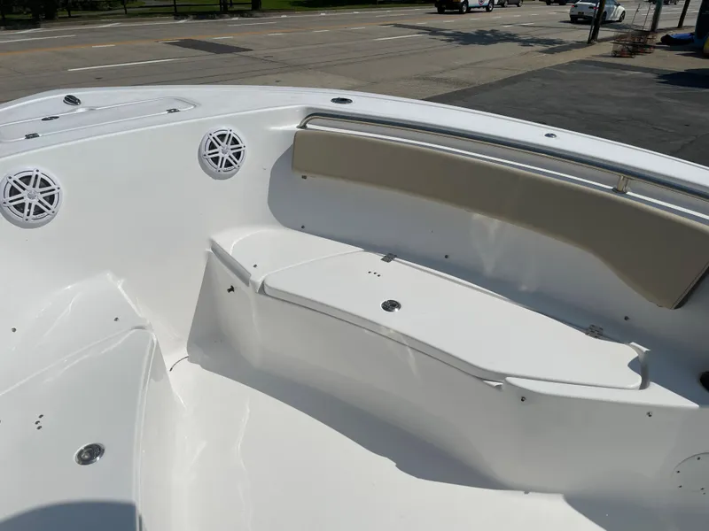 Slide: The Image of 2022 Tidewater 220 CC Adventure boat interior with seating and speakers. - 12