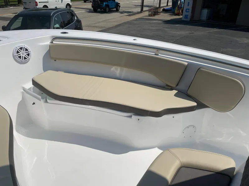 Slide: The Image of 2022 Tidewater 220 CC Adventure boat with beige seating and white interior. - 14