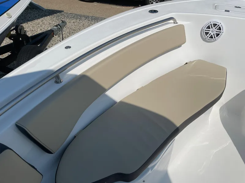 Slide: The Image of 2022 Tidewater 220 CC Adventure boat with beige seating and stainless steel rail. - 15