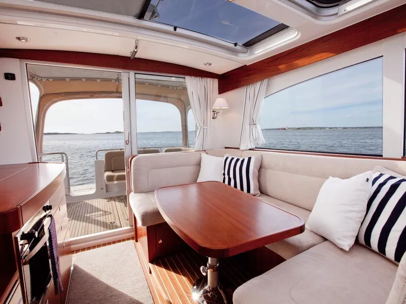 Slide: The Image of Luxurious interior of 2025 Nimbus 365 Coupe yacht with ocean view. - 10