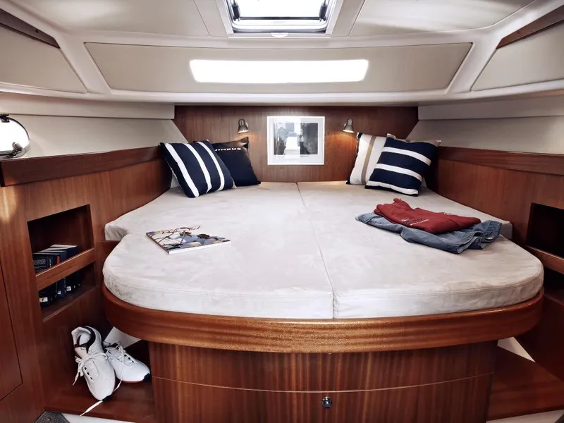 Slide: The Image of Luxurious bedroom interior of 2025 Nimbus 365 Coupe yacht with cozy bedding. - 6