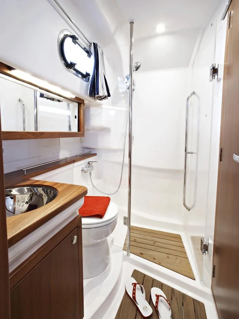 Slide: The Image of Modern bathroom in Nimbus 365 Coupe 2025 yacht with shower, toilet, and sink. - 8